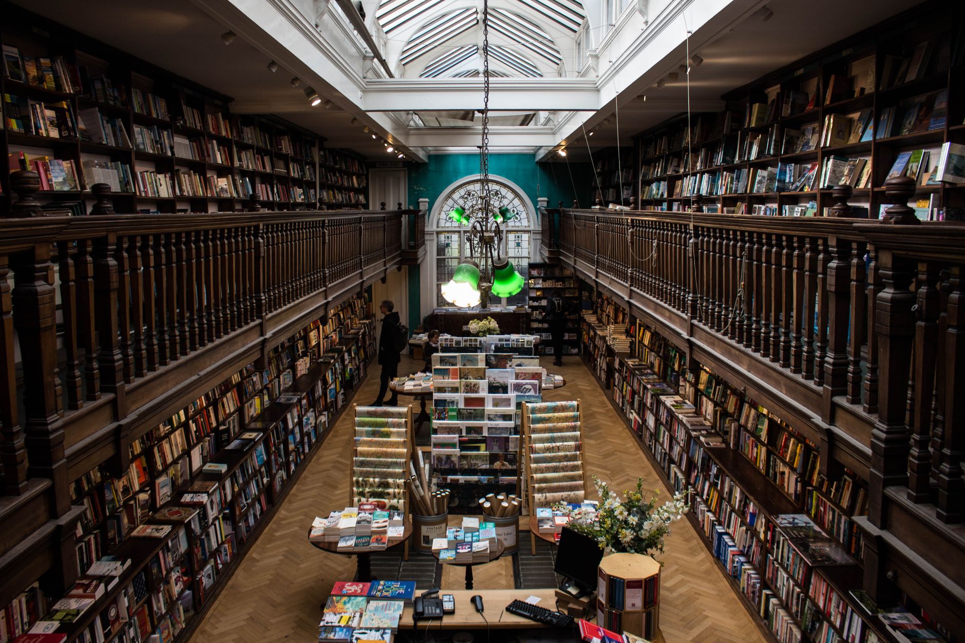 Explore the charm of a classic bookstore with stunning balconies and vast book collections.